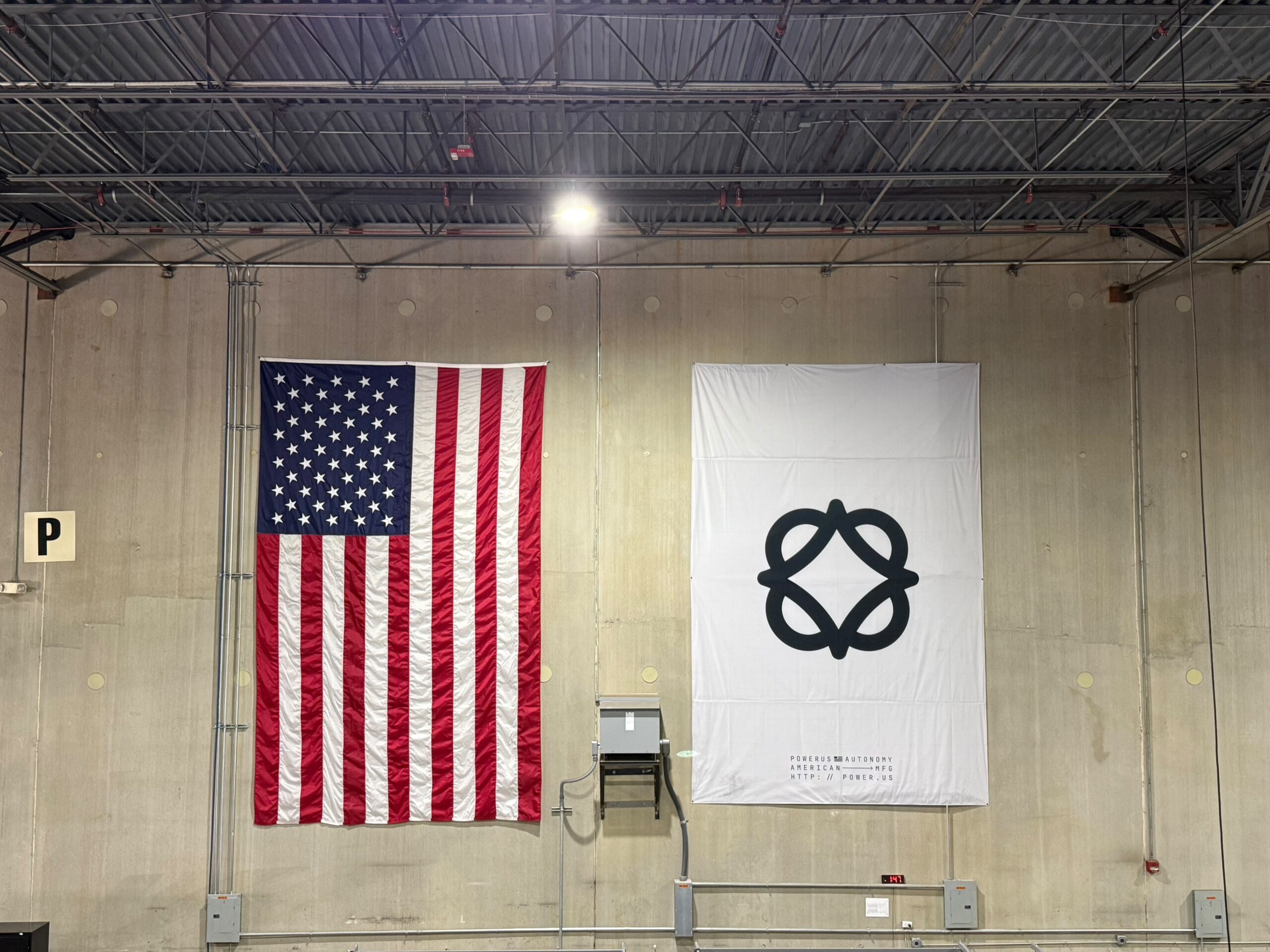 SmartSwans interior wall branding with American flag and logo wall graphics project