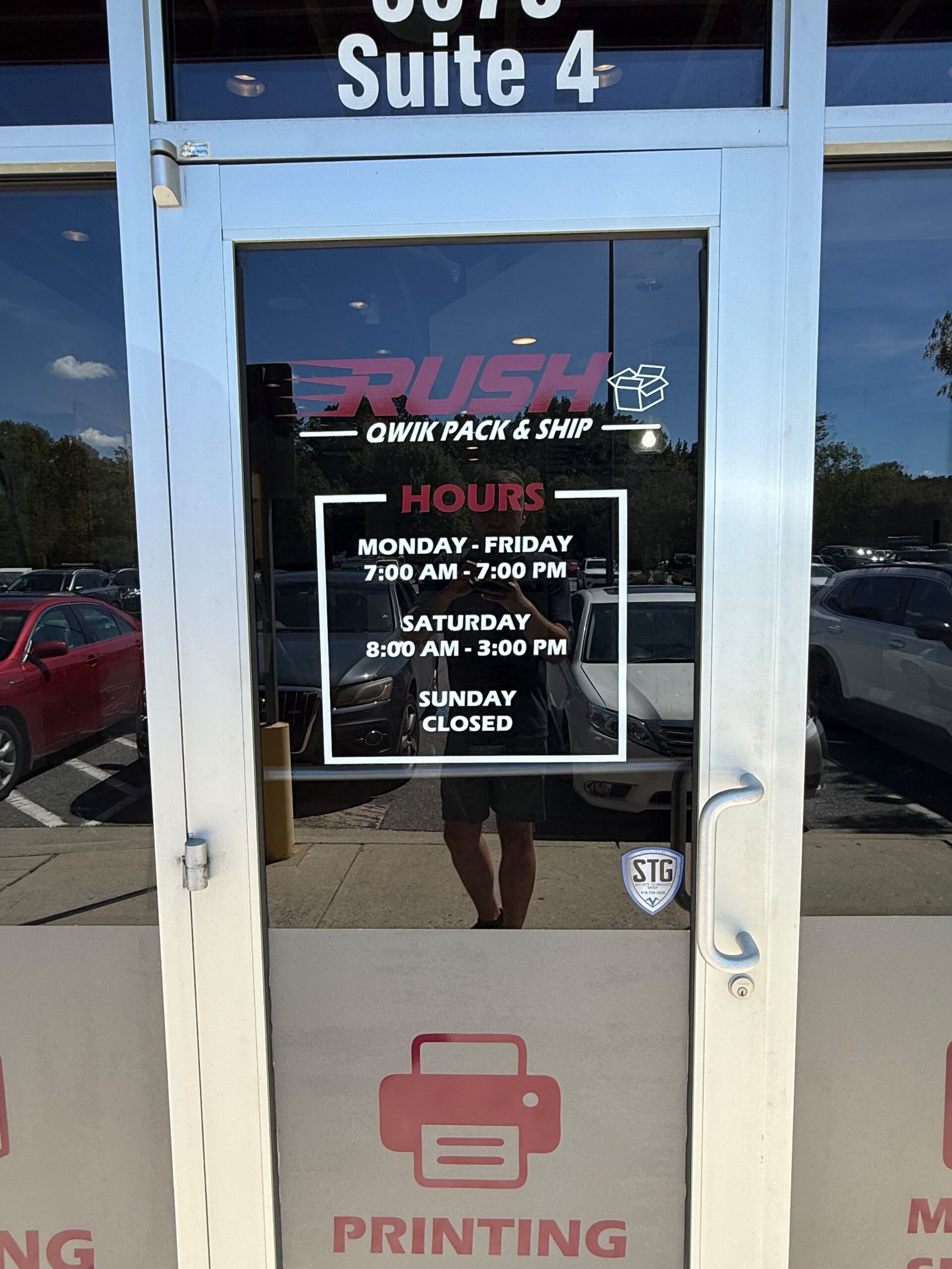 SmartSwans storefront door hours and window graphics project